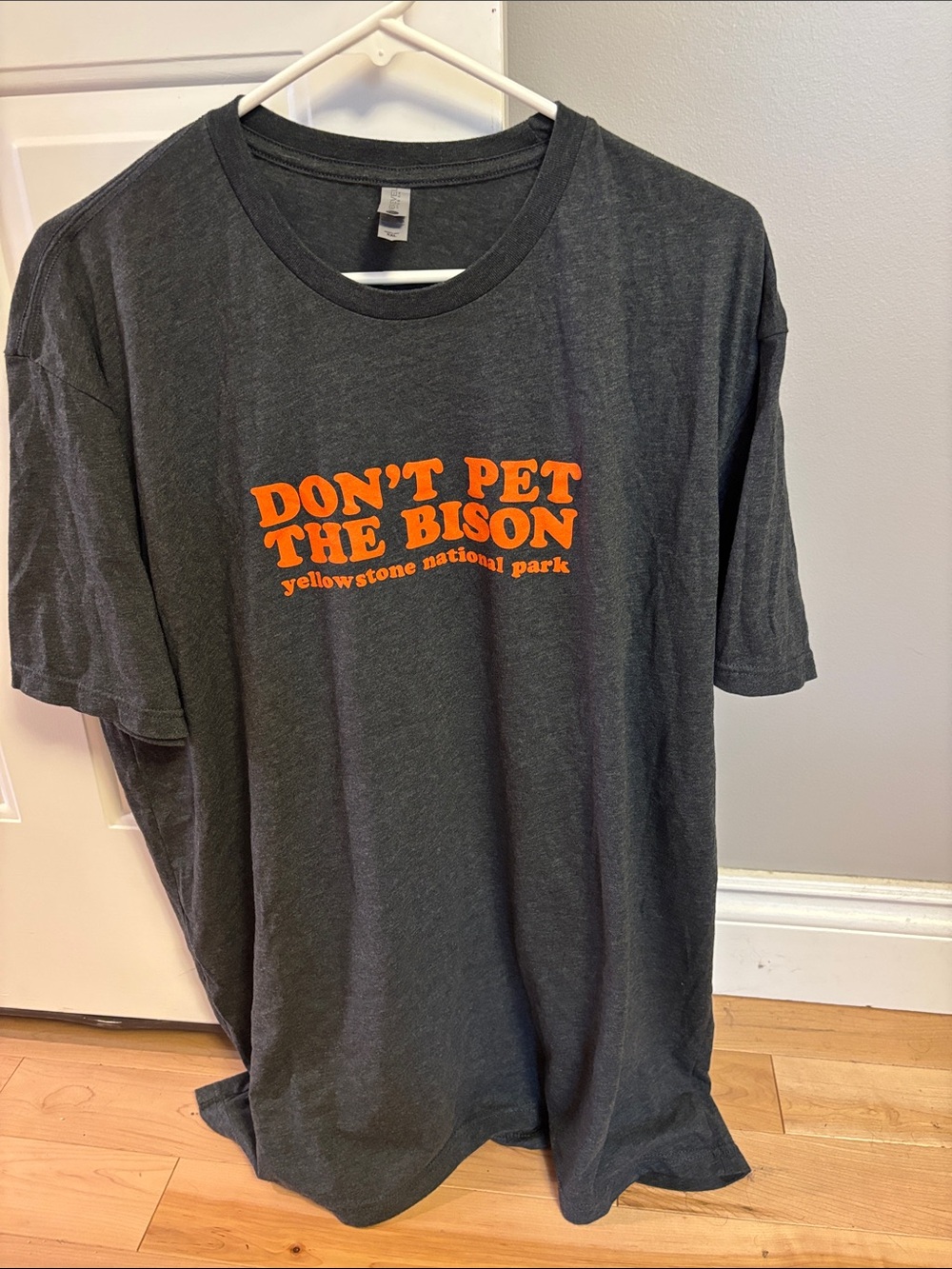 Next Level Apparel Black T-Shirt with Orange Graphic